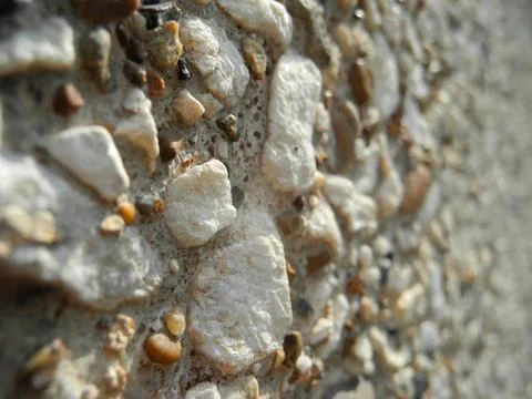 Gray small rocks ground texture. Gravel pebbles stone seamless texture. Backg Stock Photos