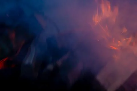Gray smoke background, fire in the grill at night close-up, fire flame Stock Photos