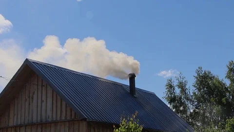 Gray smoke comes from the pipe Stockbeeldmateriaal 77402524