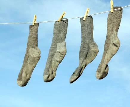 Gray socks on the line Stock Photos
