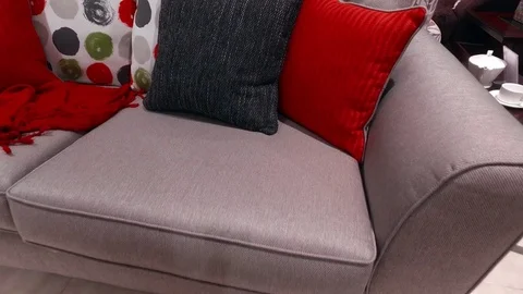 Gray sofa with bright pillows Stock Footage 79239277