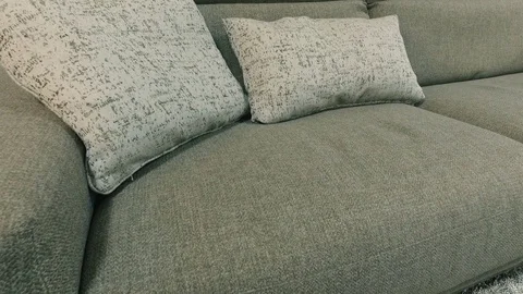 Gray sofa with cushions. Panoramic review. Hitting the camera. Close-up Video stock 75732731