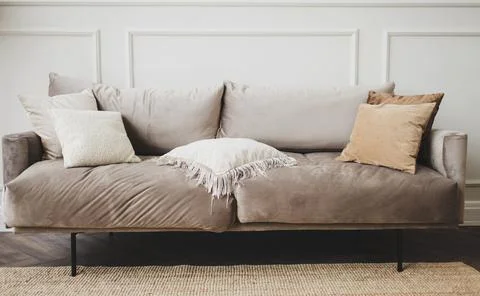 Gray sofa with pillows Stock Photos