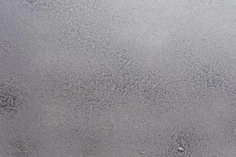 Gray soft metal surface as a background. Texture gray and solid color backgro Stock Photos