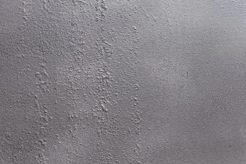 Gray soft metal surface as a background. Texture gray and solid color backgro Stock Photos