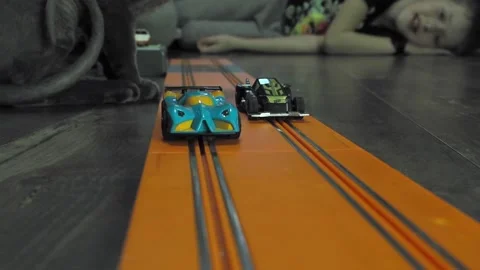 Gray sphinx cat on a toy track. Stock Footage 229846780