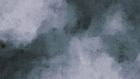 Gray spreading ink on textured paper. Watercolor abstract background loop. Stock Footage 344512240