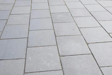 Gray stone footpath in the old port Stock Photos