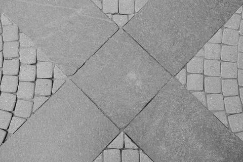 Gray stone pavement texture background with cross shape in the middle Stock Photos