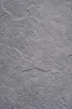 Gray stone texture background. Natural slate or rock surface. Close-up of rough Stock Photos