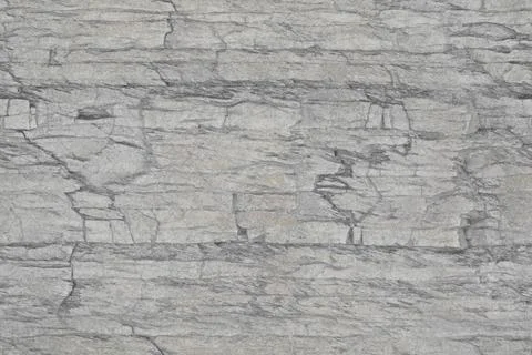 Gray stone texture with a layered and variegated appearance. The surface feat Stock-Illustration