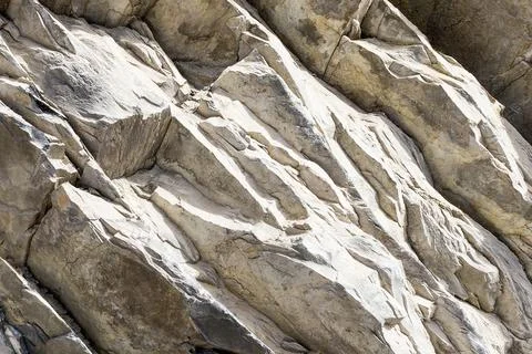 Gray stone texture of Rock layers. Bacground. Stock-Fotos