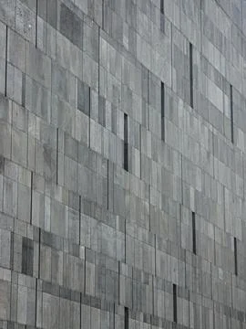 Gray stone tile facade abstract architectural texture Stock Photos