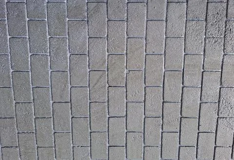 Gray stone tiles create a modern and sleek look for outdoor or indoor surfa.. 스톡 사진