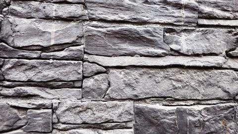 Gray stone wall background, close up Stock Photos