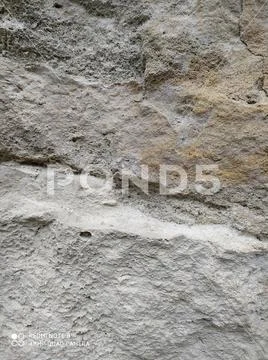Gray stone wall background, mosaic stonewall rubble facade closeup texture Stock Photos