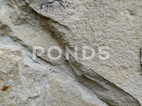 Gray stone wall background, mosaic stonewall rubble facade closeup texture Stock Photos