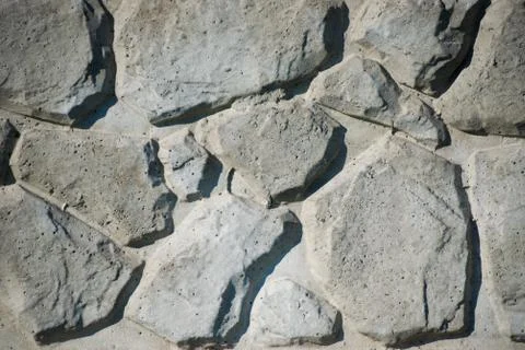 Gray stone wall background. Texture of painted brick. Stock Photos