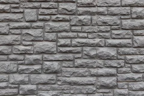 Gray stone wall full frame background. Stock Photos