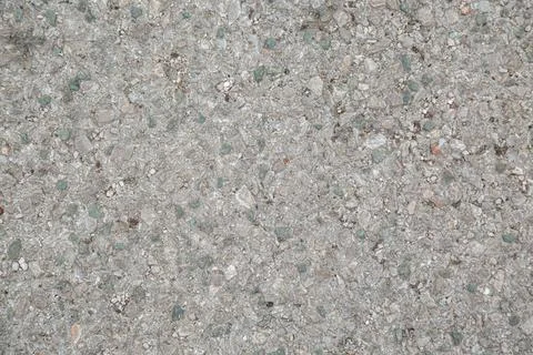 Gray stone wall made of pebbles, background, texture, backdrop Stock Photos