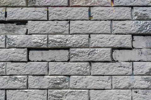 Gray stone wall with silver inserts Stock Photos