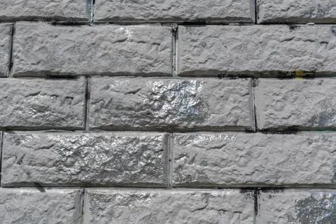 Gray stone wall with silver inserts 2 Stock Photos