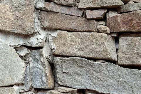 Gray stone wall weathered old vintage texture background pattern Stock Photos