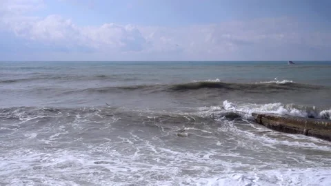 Gray storm waves crash against the breakwater. Stock Footage 175059107