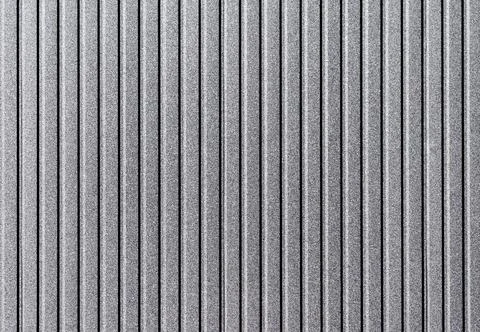 Gray striped wall of the building Stock Photos