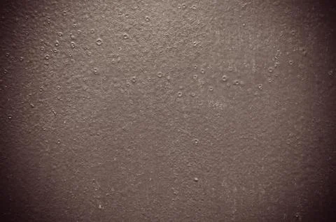 Gray structural painted wallpaper on the wall Stock Photos