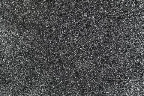 Gray surface with fine texture and white dots. Abstract neutral background for Stock Photos