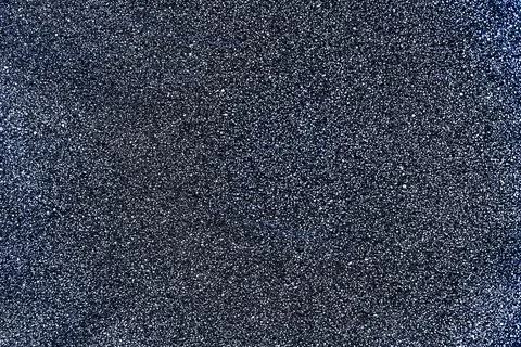 Gray surface with fine texture and white dots. Abstract neutral background for Stock Photos