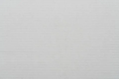 Gray surface sheet of cardboard. Close-up abstract background carton pattern Stock Photos