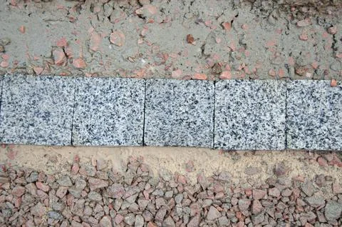 Gray texture cut blocks trench. Mining cliff of rough rock crash surface. Stock Photos