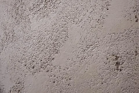 Gray texture of decorative plaster travertine close-up. Wall decor Stock Photos