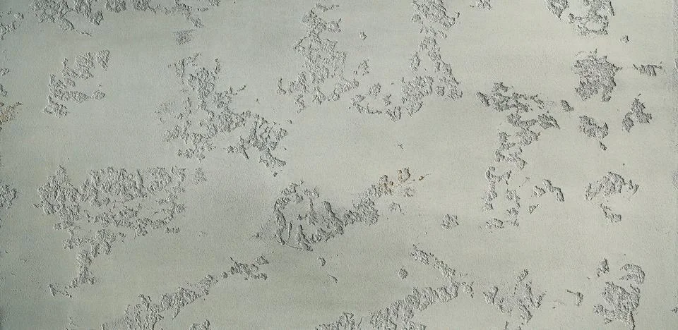 A gray texture of a rough cement wall Stock Photos