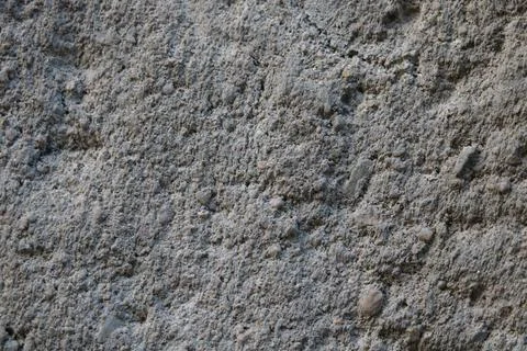 The gray texture of the stone wall of an old building or fence. 写真素材