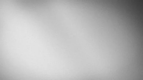 Gray textured background with black and white grainy effect in 4K resolutio.. Stock Photos