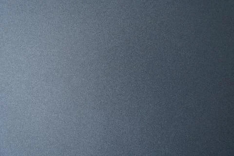 Gray textured background shows subtle patterns in light during daytime Stock Photos