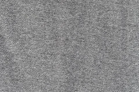 Gray textured background with subtle speckled pattern Stock Photos