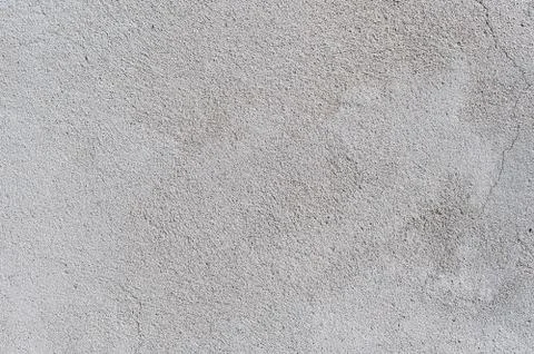 Gray textured cement wall background with fine concrete chips. Construction Stock Photos