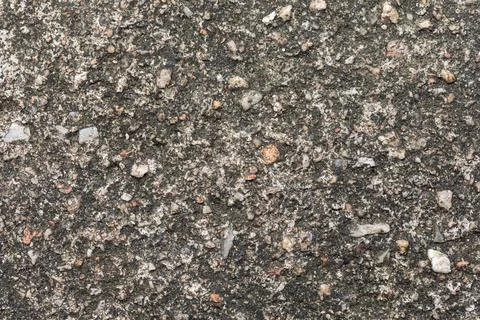 Gray textured cement wall background with fine concrete chips. Construction.. Foto stock
