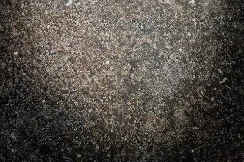 Gray textured cement wall background with fine concrete chips. Construction.. Stock Photos