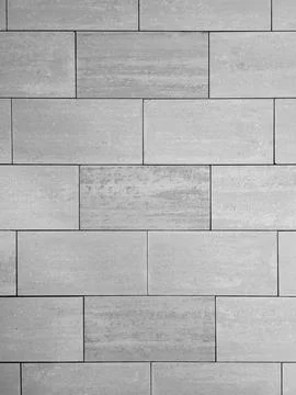 Gray textured ceramic tiles is lined offset. Stock-Fotos