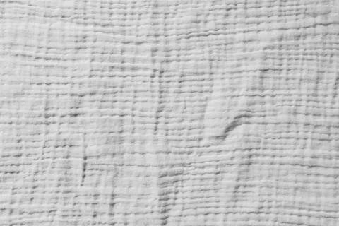 Gray textured fabric with subtle woven pattern. Soft crumpled surface  Stockfoto's