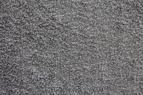 Gray textured fabric surface with soft loops and plush detail Stock Photos