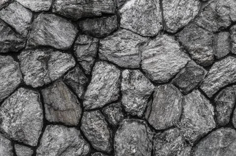 Gray textured stone wall background Stock Photos