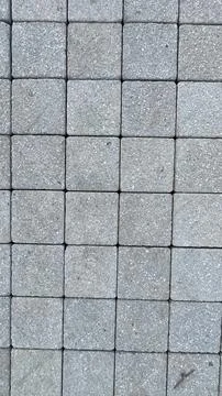 A gray tile floor with a gray tile pattern Stock Photos