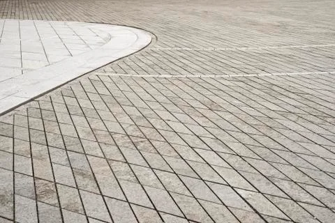 Gray tiled floor background. Old town square. Stock Photos