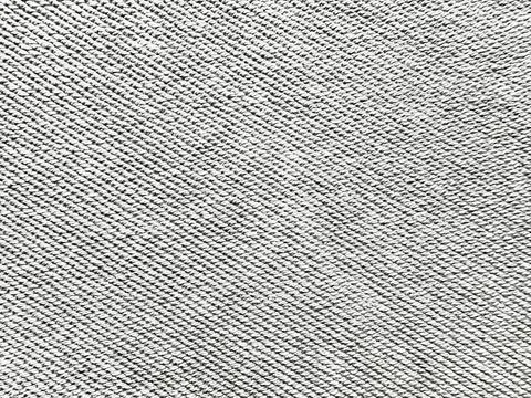 Gray twill denim texture closeup seamless woven fabric pattern evokes indus.. Stock Photos